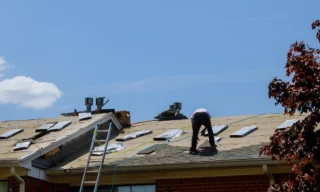 worker doing re roofing service